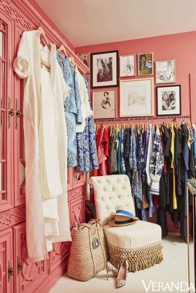 Coral closet with white hanging dress and chair