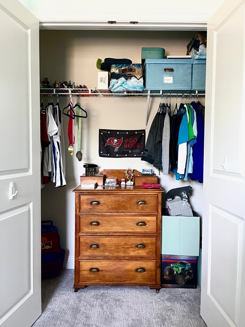 Boys closet with dresser