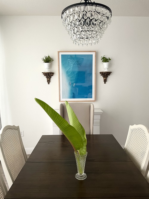 Dining room table with palm leaf