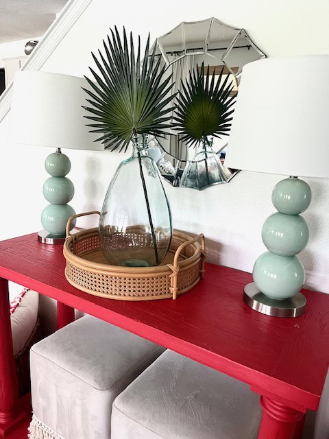 Bright coral table with aqua lamps