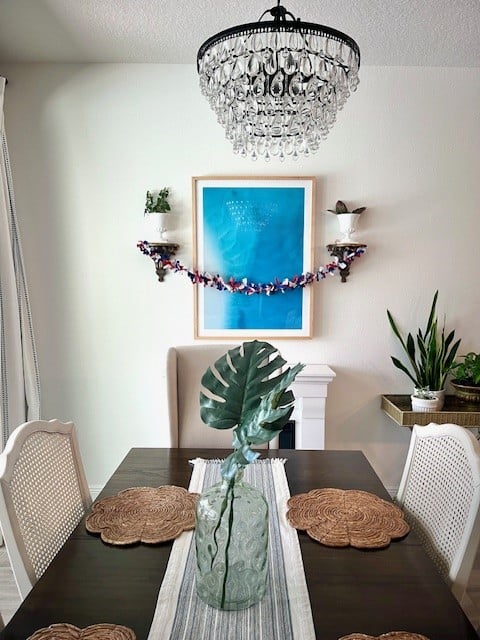 Dark wood dining table with chandelier