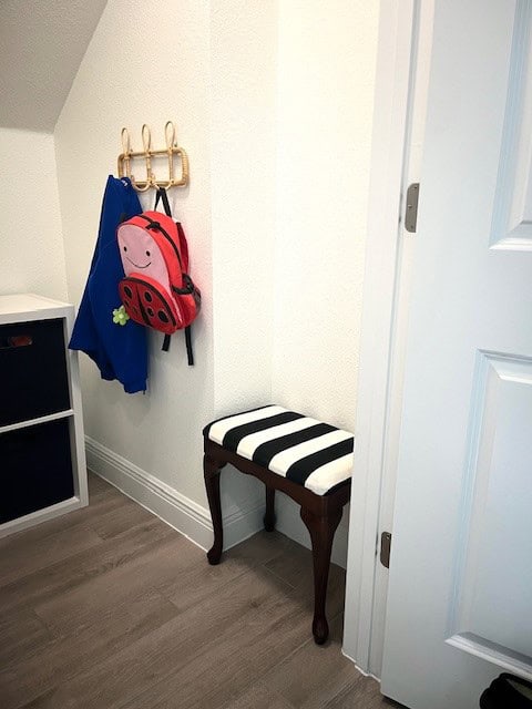 Mudroom closet with stripe bench