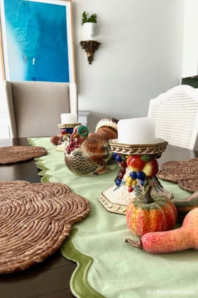 Details of ceramic candle holders on fall tablescape