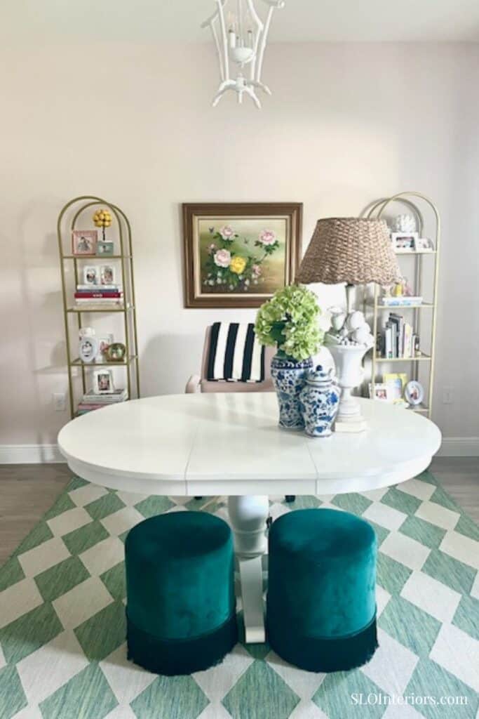 Lighting pink home office with white bamboo light fixture and gold shelves