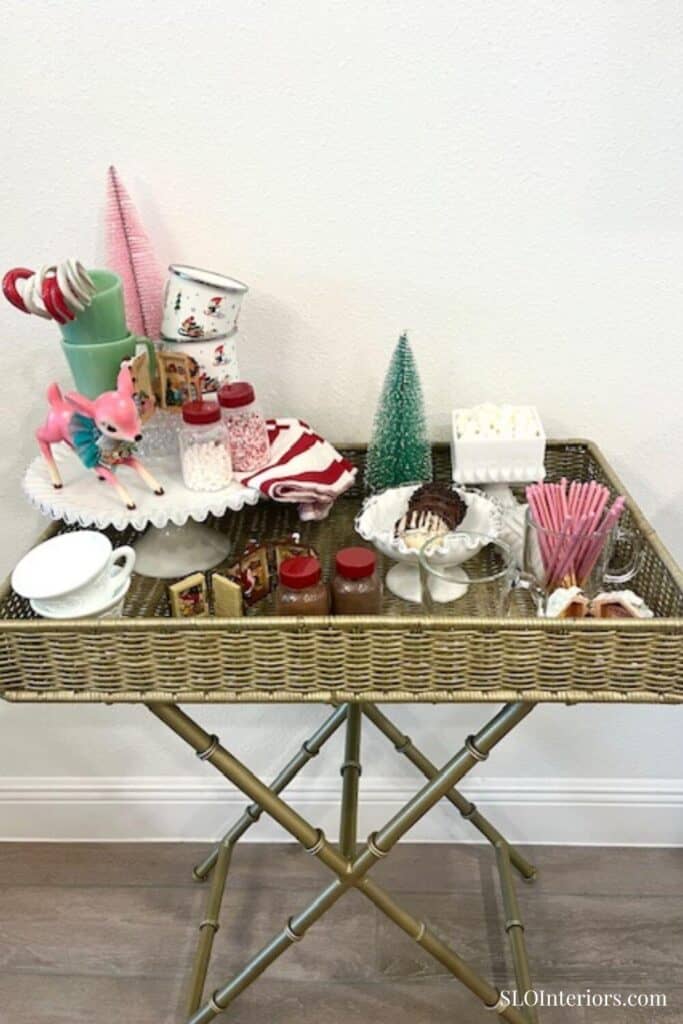 Pink, green and red holiday hot cocoa bar setup