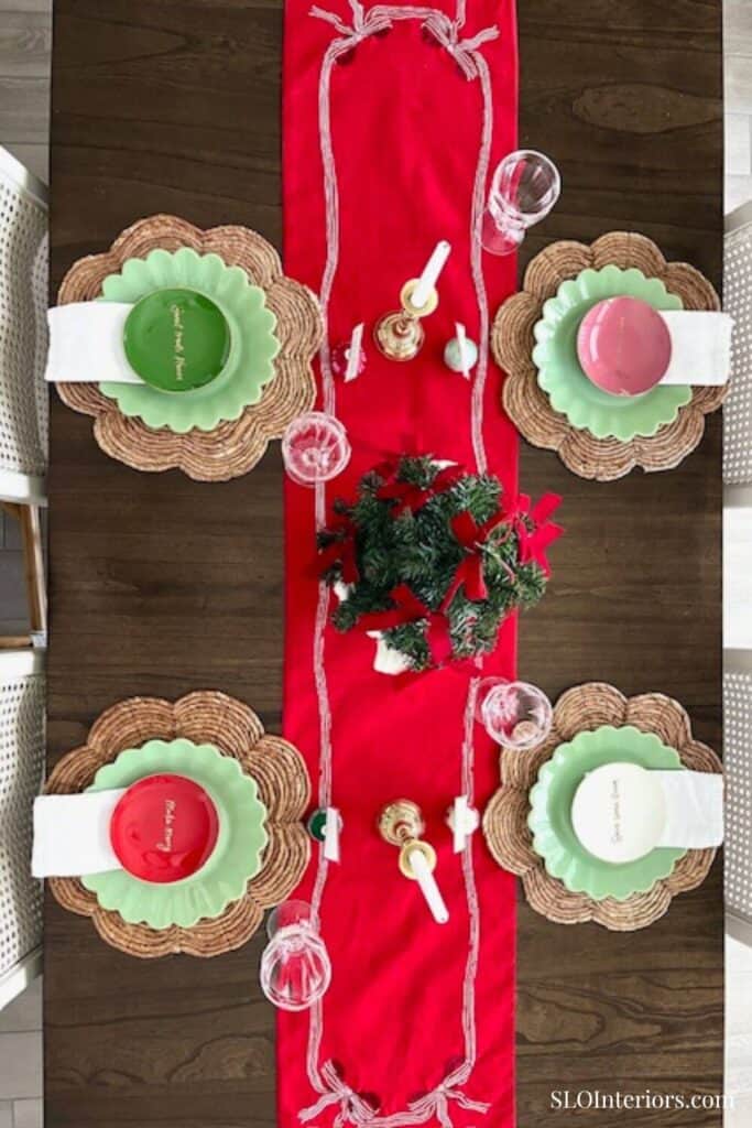 Birds eye view of Christmas table decor with red runner