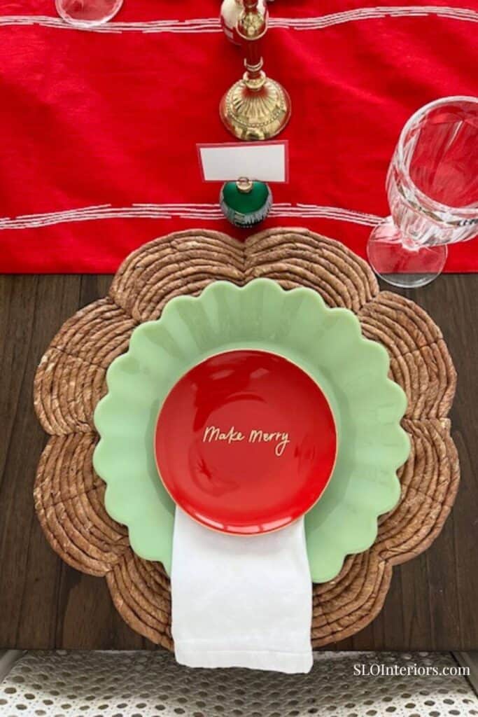 Birds eye view of Christmas table setting with red and mint green plates