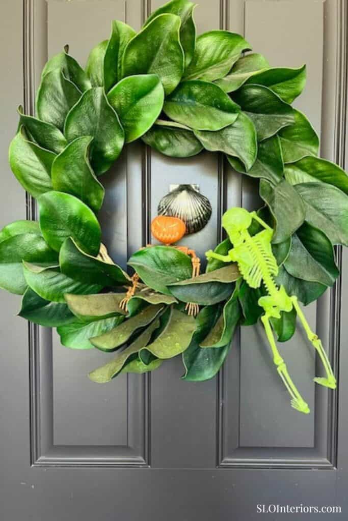 Magnolia leaf wreath on black front door