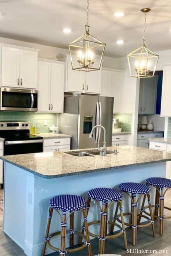 White kitchen with blue coastal counter stools