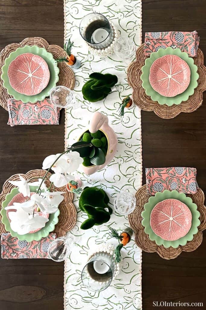 A colorful table setting with citrus-themed plates and elegant tableware for a stylish dining experi.