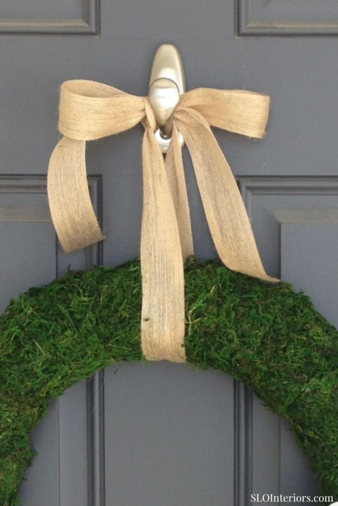 Close up of a burlap ribbon bow on a DIY spring wreath