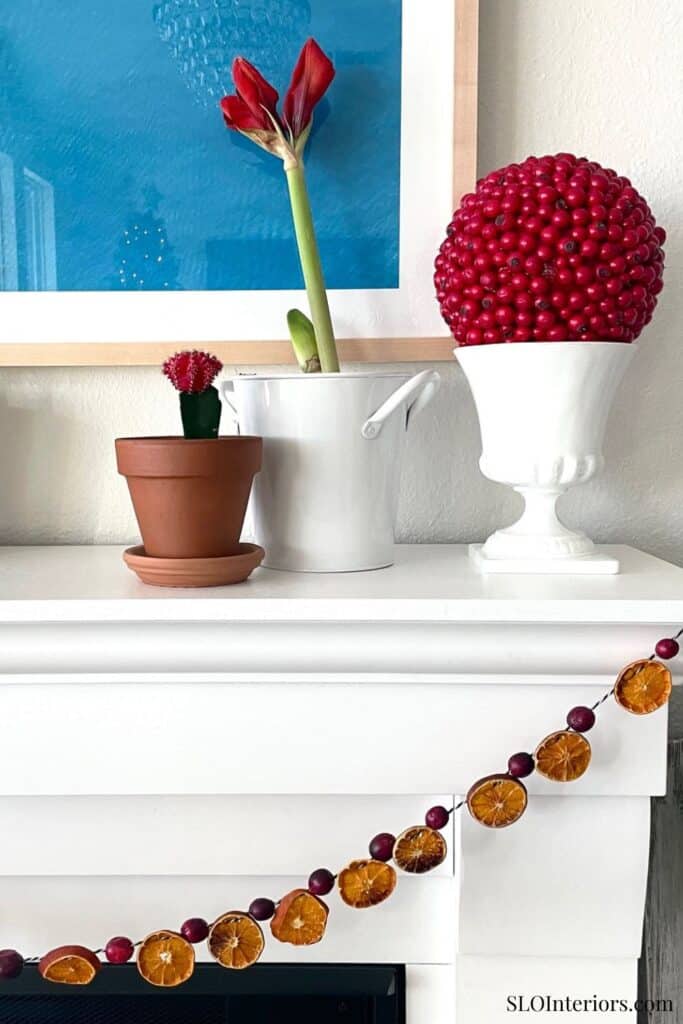 A colorful floral arrangement with decorative ornaments on a white surface.