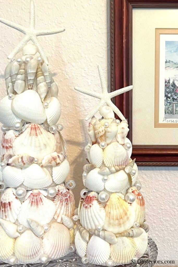 Beach-themed shell and starfish decorative sculptures for coastal interior decor.