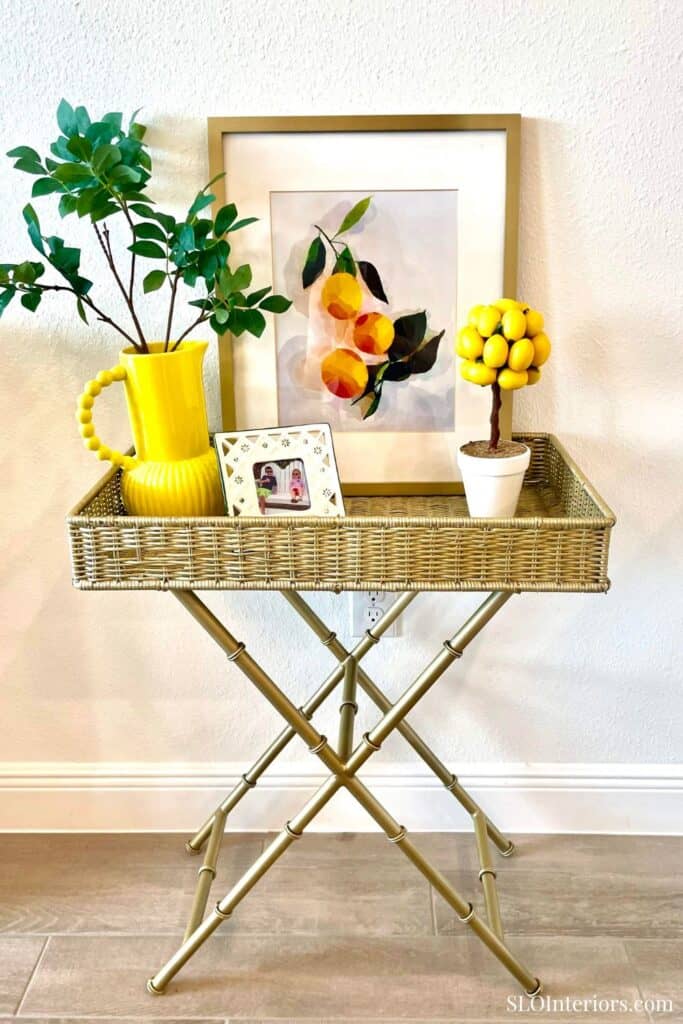 Styled gold tray table with yellow lemon home decor