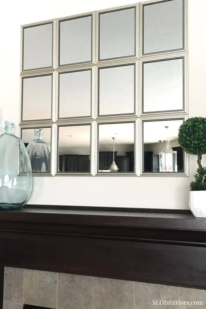 Modern wall mirror with multiple square frames in a contemporary interior design.