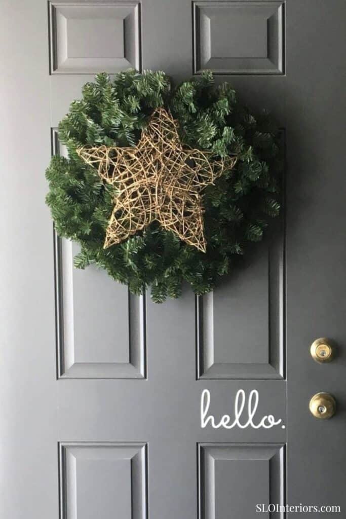 Christmas wreath with a star decoration on a gray door, holiday home decor, SLO Interiors.