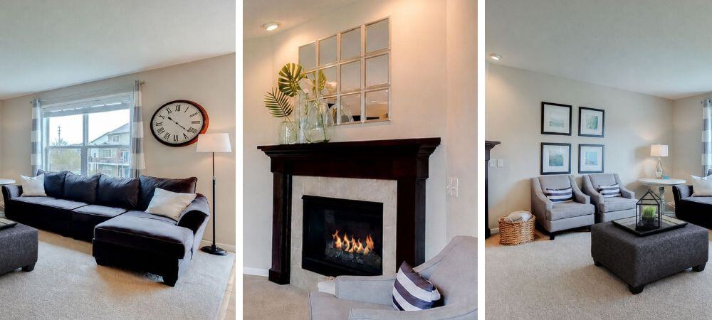 Modern living room with large window, fireplace, and cozy seating area.