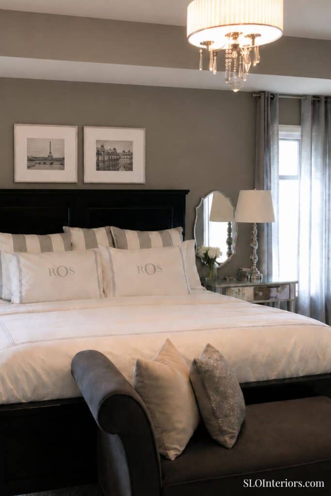 Elegant bedroom with neutral tones, modern decor, and stylish lighting fixtures.