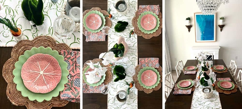 A colorful, elegant table setting with pink citrus-themed plates and floral decor.