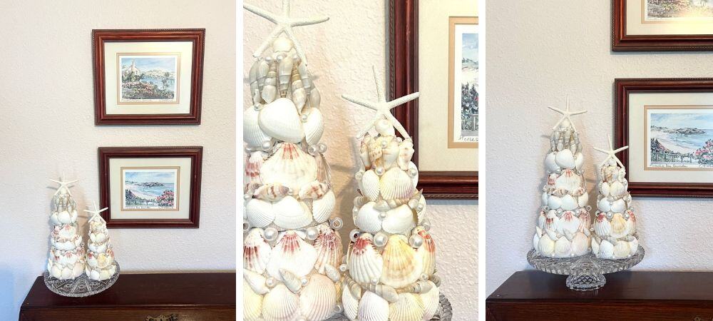 Seashell Christmas tree decorations with framed coastal artwork on wall.