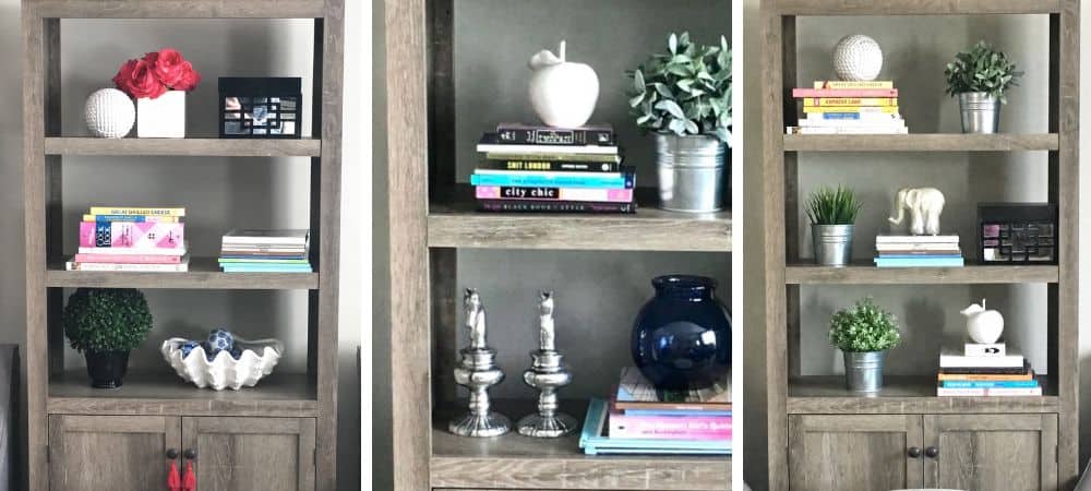 Elegant wooden bookshelves with decorative vases, plants, and books in a modern interior.