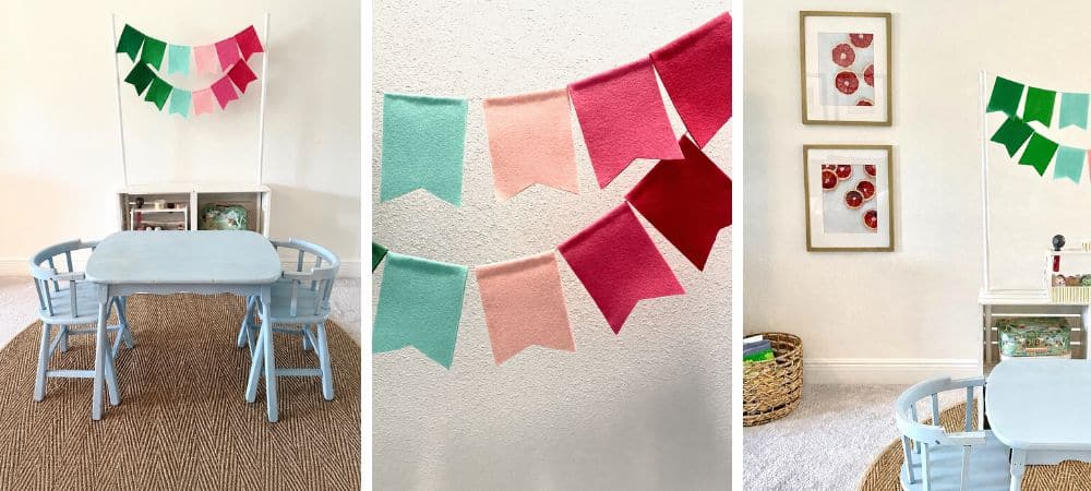 A colorful party banner with pastel and red flags hanging in a bright, modern dining room.