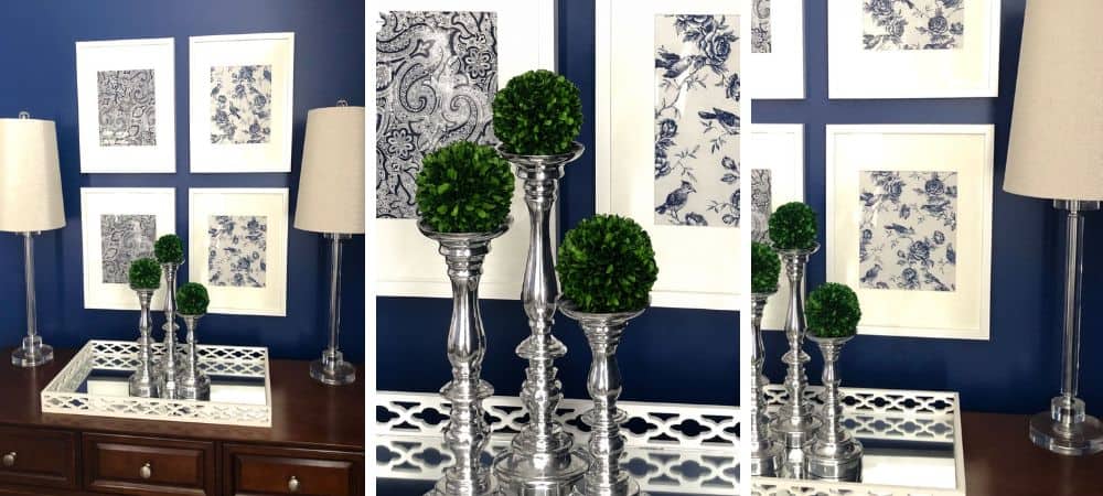 Elegant interior decor with blue and white floral artwork and green topiary accents.