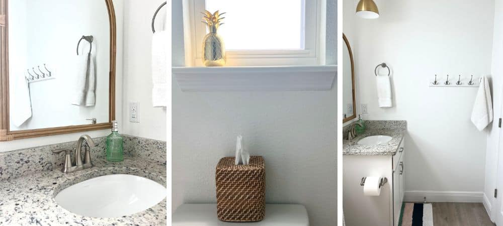 Modern bathroom with granite countertop, white walls, and minimalist decor.